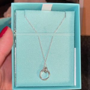 This is a Tiffany Paloma’s Melody mini pendent.